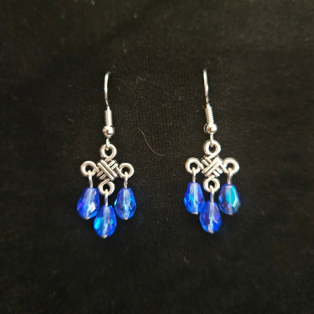 Antique silver Celtic knot and iridescent blue teardrop chandelier earrings